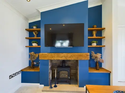 Lounge oak-detailed fireplace wall
