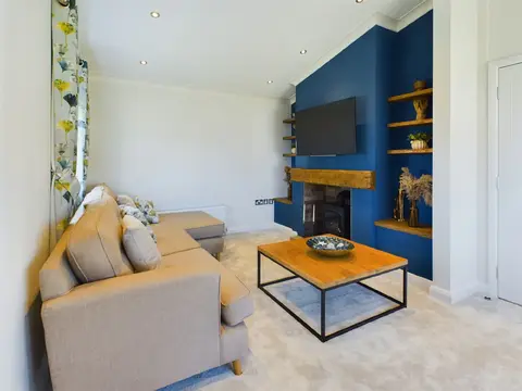 Lounge featuring electric stove fire