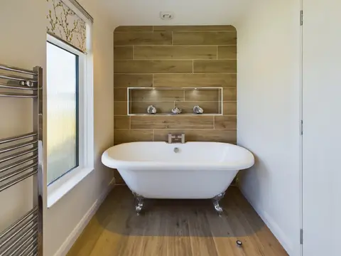 Bathroom with roll‑top bath