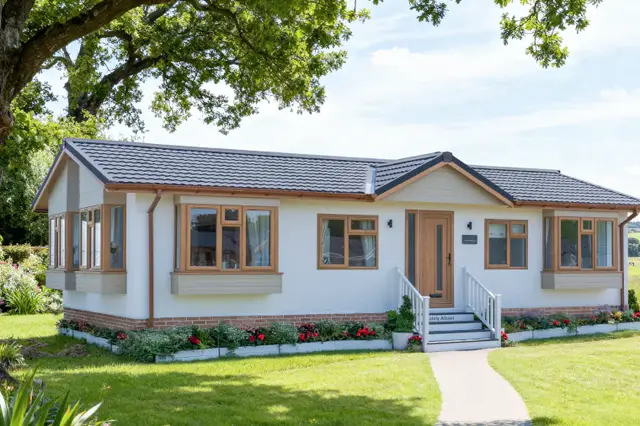 Chatsworth Gold residential park home sited in a flower garden