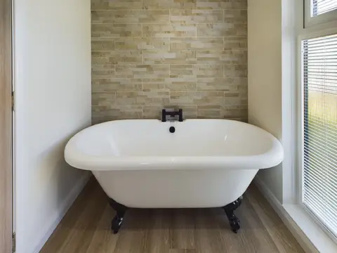 Bathroom with roll‑top bath