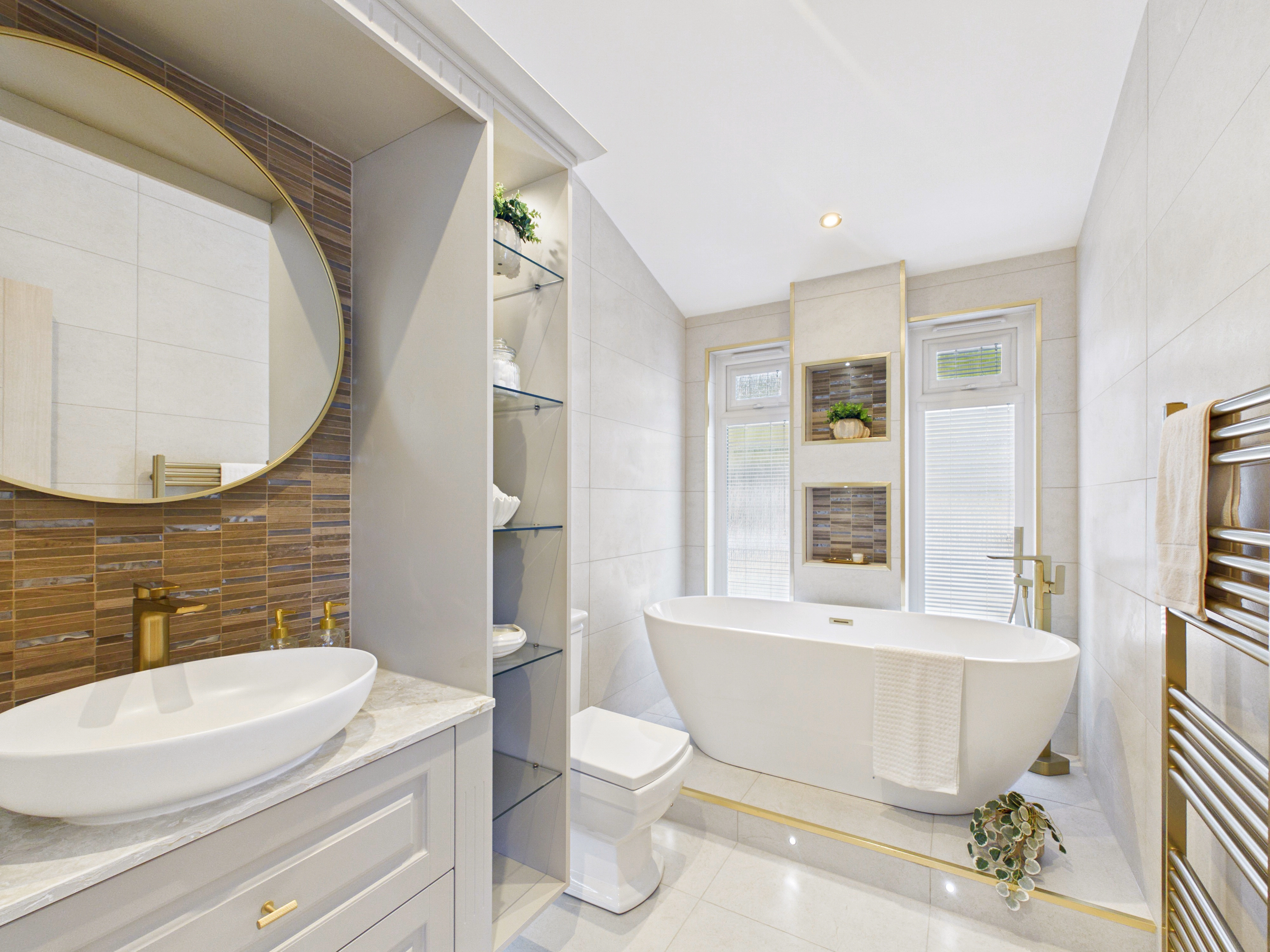 Redesigned Diamond show home bathroom with a freestanding bath, quartz vanity and gold fittings